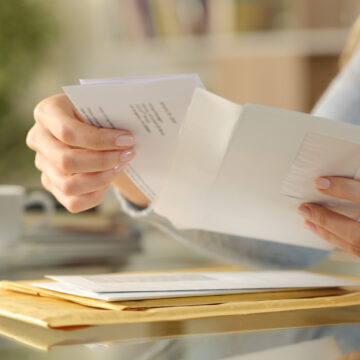 OE member opening mail at desk