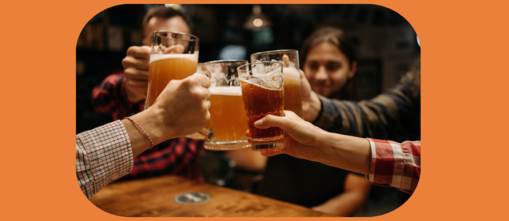 Image of people with beers toasting.