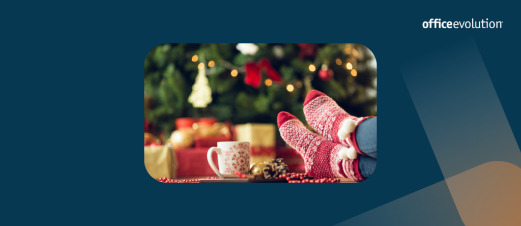 Christmas decor and someone's feet on the table with festive socks.